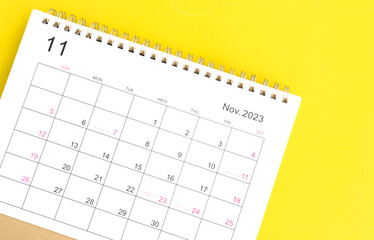 calendar november 2023 top view new year concept on a yellow background