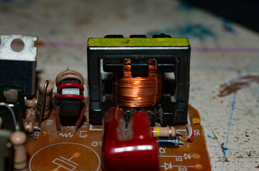 Electrical inductor in lamp circuit.