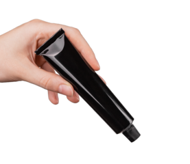 Hand holding black cream tube mockup isoalted on white background