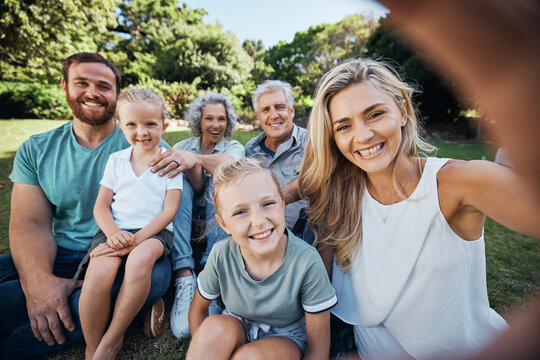 Family selfie, park portrait and woman with smile on holiday in nature in Canada during summer. Parents, girl kids and grandparents taking photo on vacation in a green garden for picnic in spring