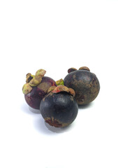 Three mangosteen isolated on white background