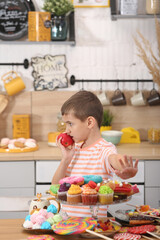 Child and sugar, sweets. Giving up the sweet. Happy baby, boy with apple. Health of child, healthy diet, healthy food, nutrition, harmful and healthy meal. Child love fruits, apple. Child and snaсkes