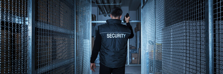 Security Guard Standing In The Warehouse