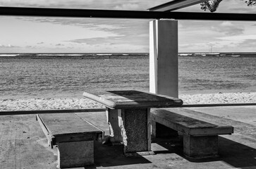 Empty Bench and Beach in Black and White.