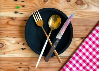 knife, spoon  and fork on wooden table