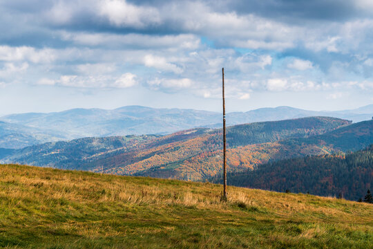 Beautiful view of the Beskids from Rysianka. Autumn mountain landscape on a sunny day. Marking the tourist trail. Węgierska G&oacute;rka, Poland