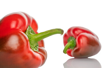 Two juicy ripe, sweet peppers, close-up, isolated on white.