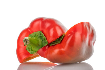 Two halves of red sweet pepper, close-up, isolated on white.