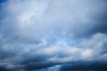 A large white cumulus cloud before the storm is approaching. Heavy cloudy. Clouds before thunderstorm. Summer sky with curly white clouds.