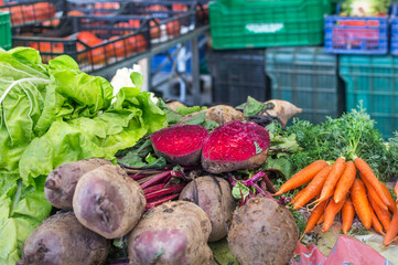 Vegetables from a producer farmer in a market. Fresh, eco, biological, healthy food. Concept of sustainable shopping. 