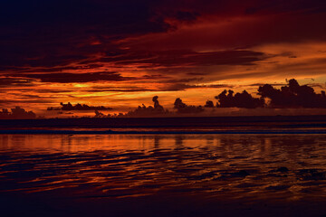 Fototapeta na wymiar Landscape of sunset at Chaung Tha beach. Cloudy sky. Ending hour at seaside.