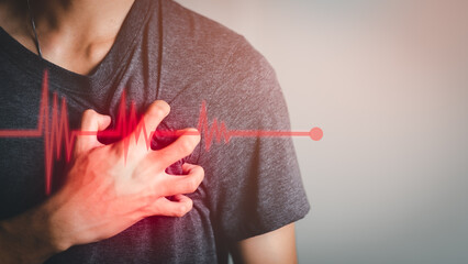 Severe heartache, man hands holding chest with symptom heart attack disease, heartbeat line, Heart attack symptom-Healthcare and medical concept.