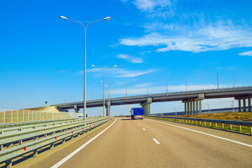 Tavrida highway. Multi-lane countryside asphalt road with marking. Intersection of the roads on two levels.