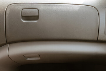 Naklejka premium Gray glove box on the passenger panel side of the car
