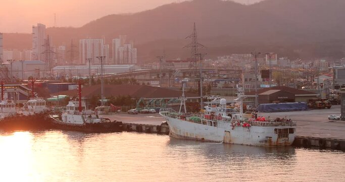 Spring, 2018 - Donghae, South Korea - Sea industrial port in the city. Commercial industrial ships stand at the mooring wall of the sea city.