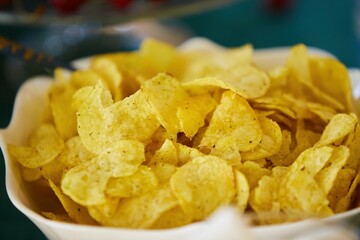 Potato chips in a plate on the table