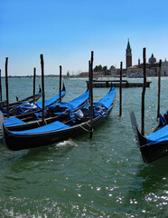 Fototapeta na wymiar Covered gondolas in Venice lagoon, Italy. 