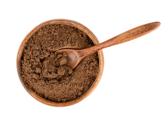 Top view of a wooden bowl with ground cinnamon and a spoon in it.
