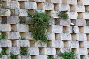 High wall made of stone and concrete.