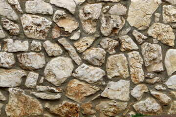 High wall made of stone and concrete.
