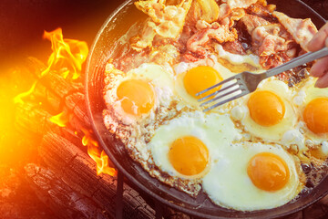 natural light. barbecue. a frying pan is used for cooking. fire. firewood. Picnic