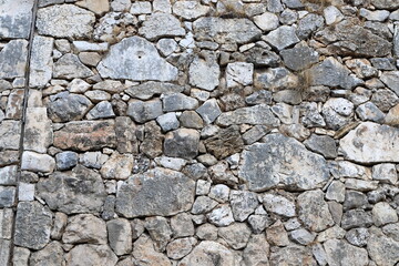 High wall made of stone and concrete.