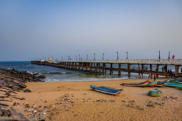 Fototapeta na wymiar The Rock Beach of Pondicherry or Puducherry, also known as Promenade Beach or Gandhi beach, is an exceptional place where the shore is densely populated by majestic rocks. At Tamilnadu, South India.