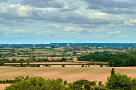 Scenic view from the Chiltern hills looking towards an open field on a sunny day