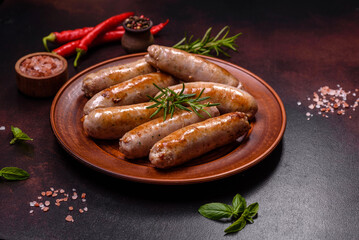 Roasted sausages grill with spices and herbs with salt and pepper