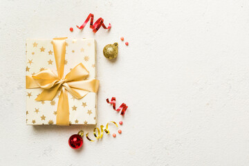 Top view Flat lay Christmas decorations and gift box on colored background with copy space. Christmas or Happy New Year composition