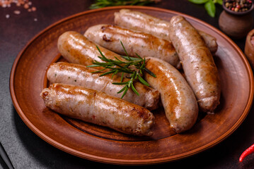 Roasted sausages grill with spices and herbs with salt and pepper