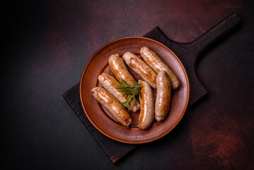 Roasted sausages grill with spices and herbs with salt and pepper