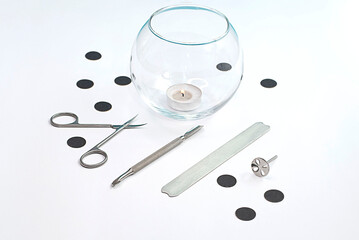 Mockup of metal tools for manicure on a white background.