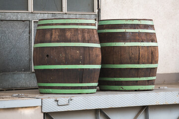 Two big wooden barrels waiting for transport