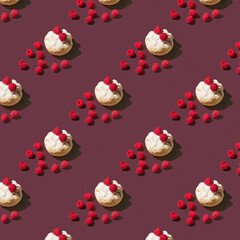 pattern of a bun with powdered sugar and raspberries on a dark red background