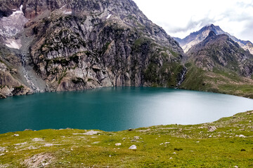 Beautiful mountain scenery. River, valley, snow, blue sky, white clouds. In-depth trip on the Sonamarg Hill Trek in Jammu and Kashmir, India
