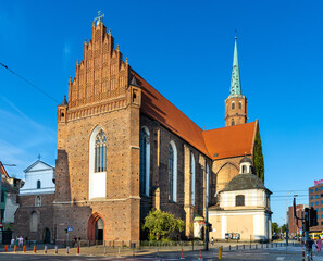 Fototapeta na wymiar St. Adalbert St. Wojciech Dominican gothic church at Dominikanski square in historic old town quarter of Wroclaw in Poland