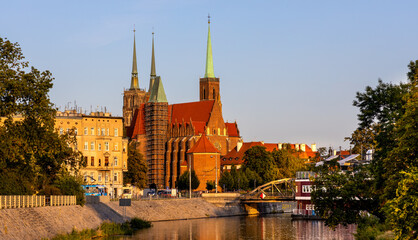 Panoramic view of Ostrow Tumski Island over Odra river with St. John Baptist cathedral in historic old town quarter of Wroclaw in Poland