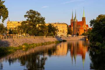 Panoramic view of Ostrow Tumski Island over Odra river with St. John Baptist cathedral in historic old town quarter of Wroclaw in Poland