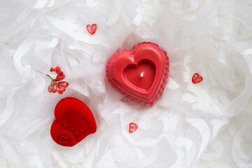 valentine's day background. handmade soy candle made of natural soy wax in the shape of a red heart