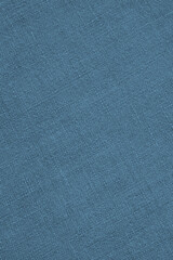 Blue woven surface close-up. Linen textile texture. Fabric sewing background. Textured braided backdrop. Len vertical wallpaper. Macro