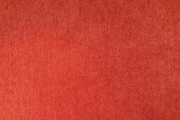 Fototapeta premium Texture background of velours red fabric. Fabric texture of upholstery furniture textile material, design interior, wall decor. Fabric texture close up, backdrop, wallpaper.
