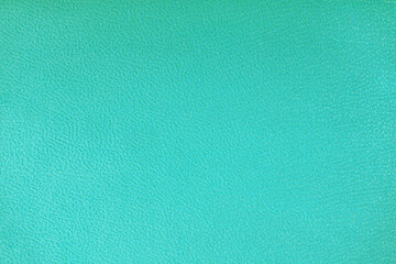 Texture background of velours turquoise fabric. Fabric texture of upholstery furniture textile material, design interior, wall decor. Fabric texture close up, backdrop, wallpaper.