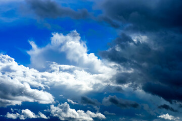 Beautiful dramatic sky with white and dark blue storm clouds, contrast sky
