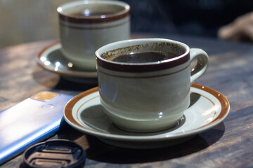 cup coffe at traditional table