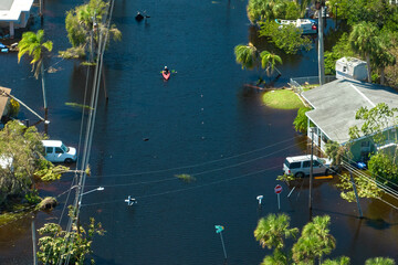 Flooded houses by hurricane Ian rainfall in Florida residential area. Consequences of natural...
