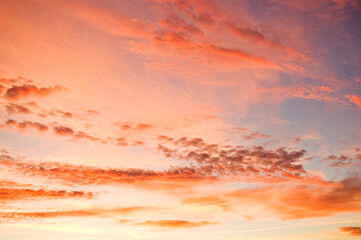 Orange clouds against evening sky.