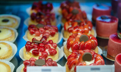 Tasty cakes with strawberries in  Germna food store