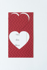 Fototapeta na wymiar heart shapes with the trilingual words two, dos, and deux