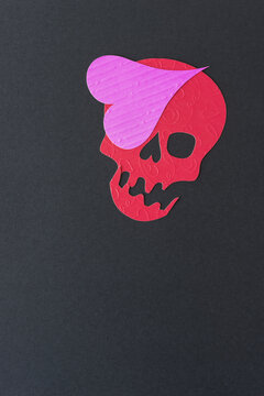 red paper skull head pirate with heart shaped eye patch